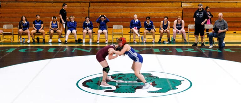 Squalicum wrestlers watch a teammate during a dual meet Tuesday