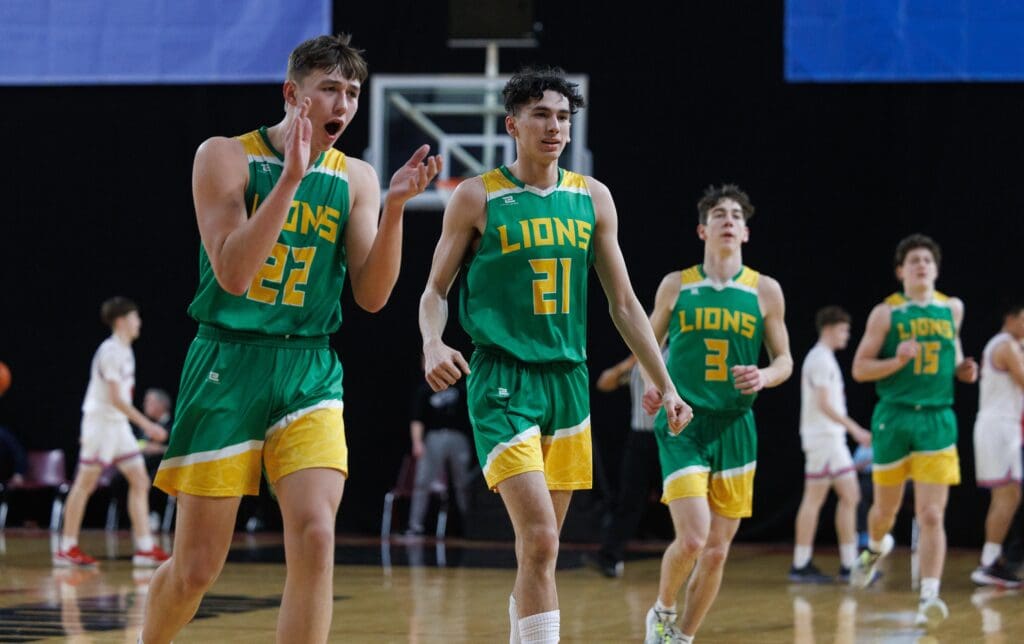 Lynden’s Brant Heppner, left, celebrates as he reacts and claps his hands as his teammates jog over.