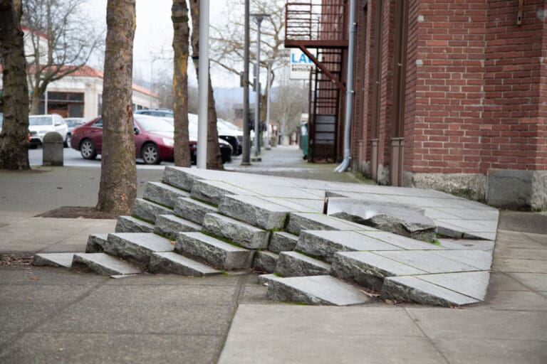 "Days Go By" was sculpted into Bellingham's sidewalk which looks like a staircase coming out of the ground.