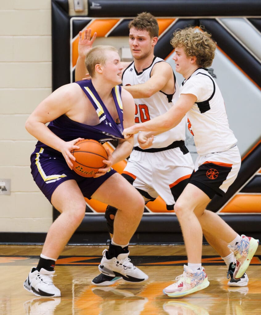 Bellingham's Daniel Banks gets a hand in the jersey of Nooksack Valley's Brady Ackerman in the finals seconds of the game.