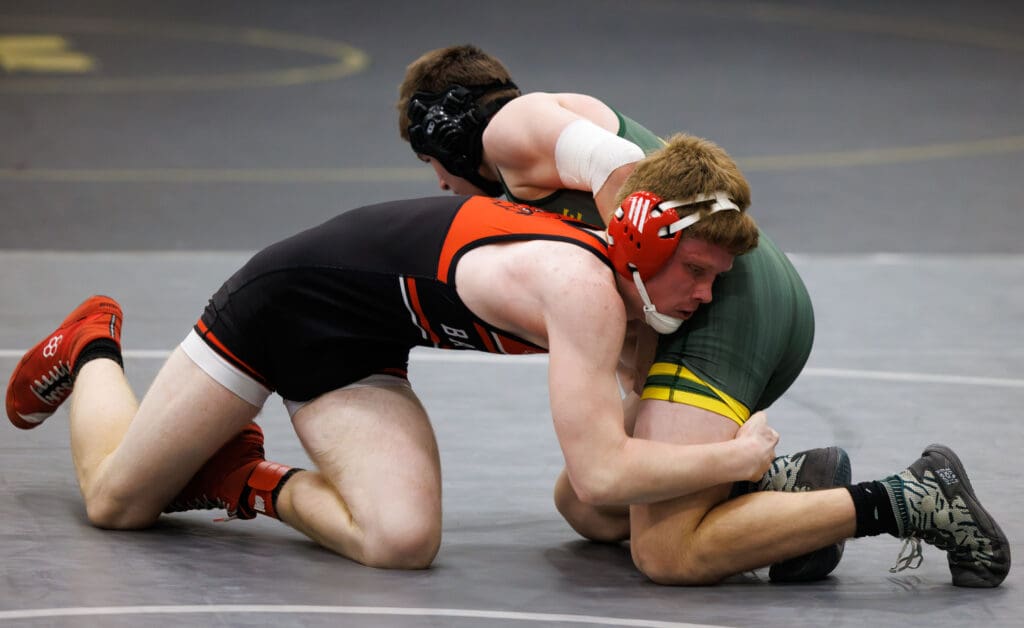 Bellingham's Alex Scott grapples with Sehome’s Aiden Holmes.