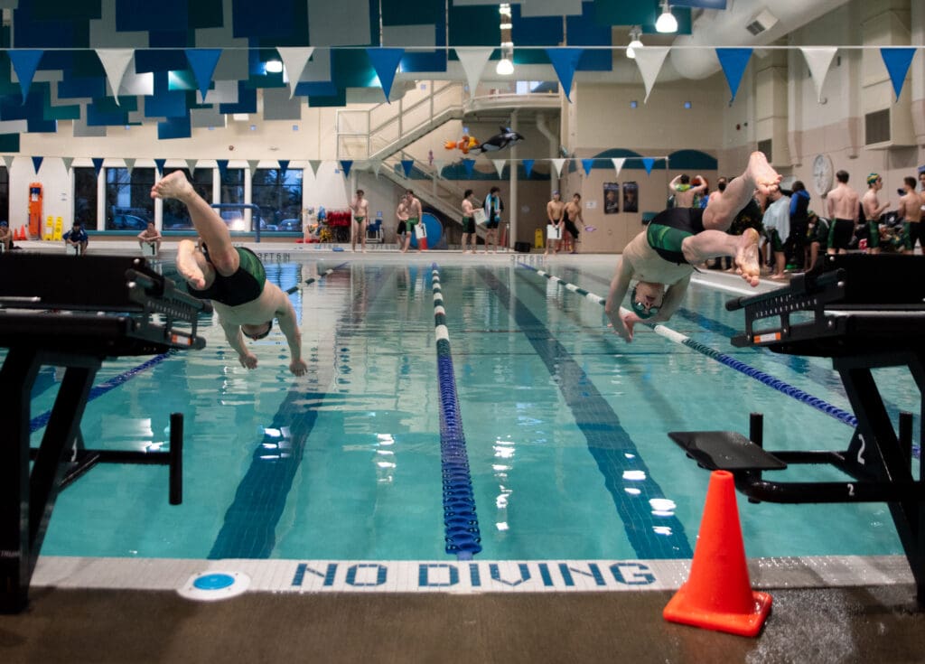 Sehome's Jamison Schmidt, left, and Jack Wrightson dive into the first lap of the 500 freestyle.