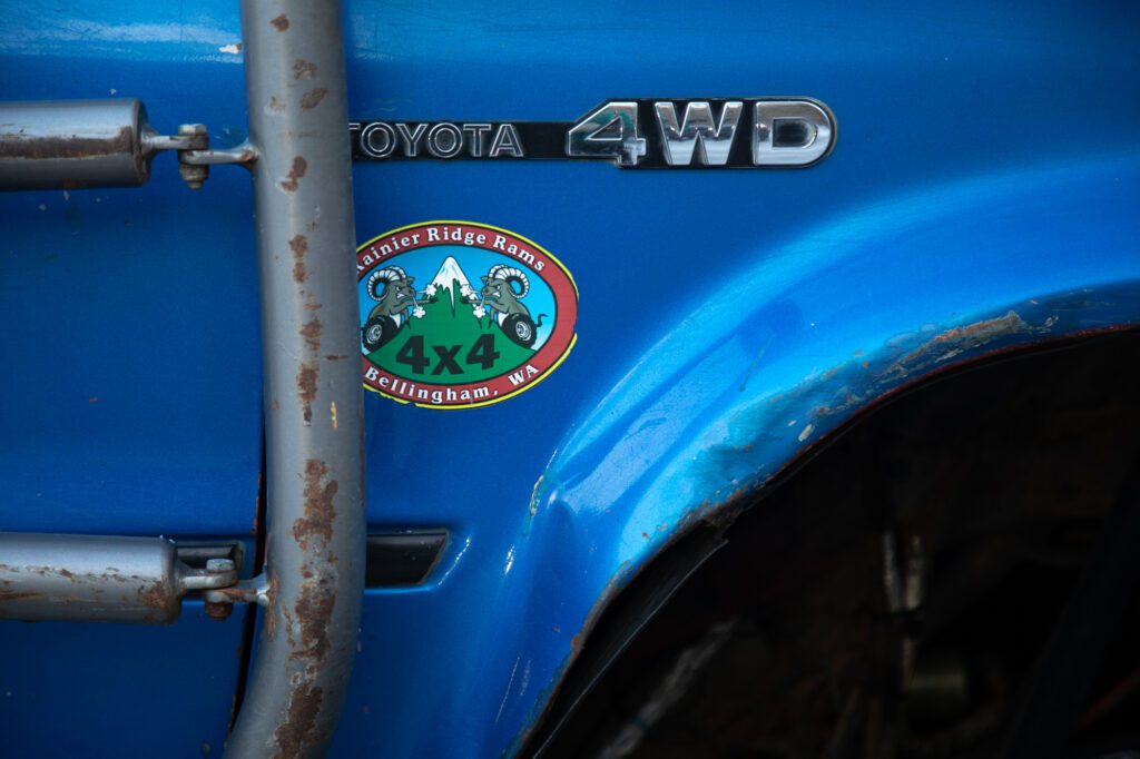 A "Rainier Ridge Rams" sticker is visible on one of the Toyotas.