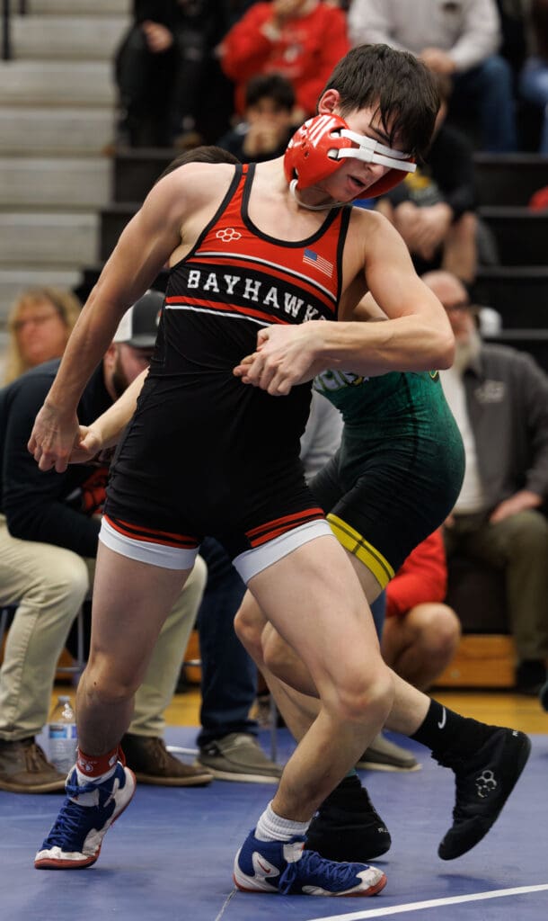 Bellingham's Daniel Kuhn spins out of a hold while his headgear blocks his vision.