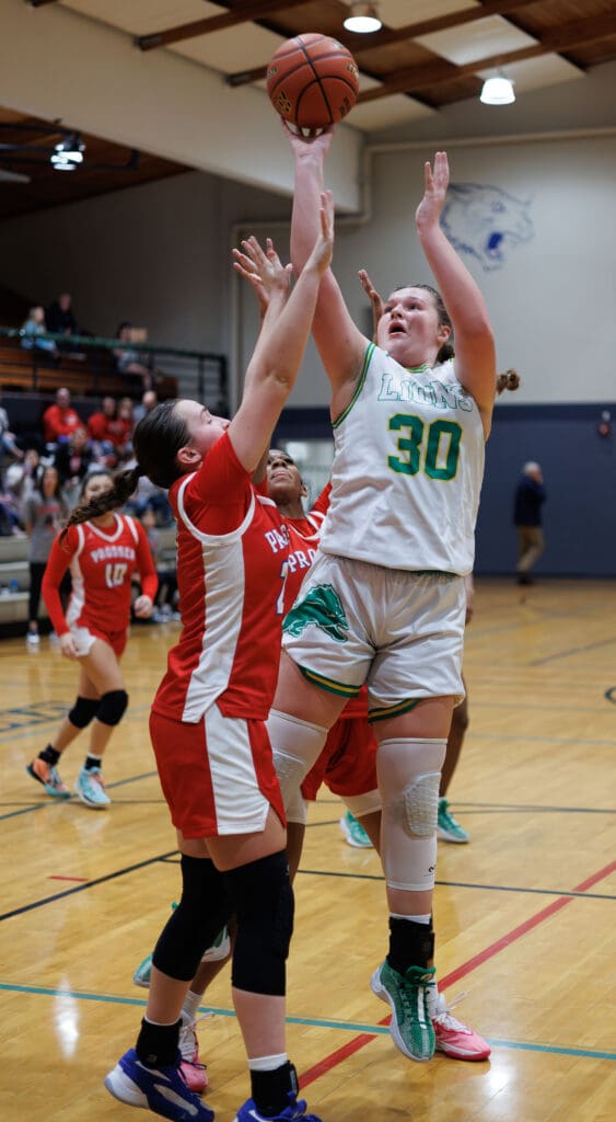Lynden’s Payton Mills hits a jump shot in a Prosser defender's face.