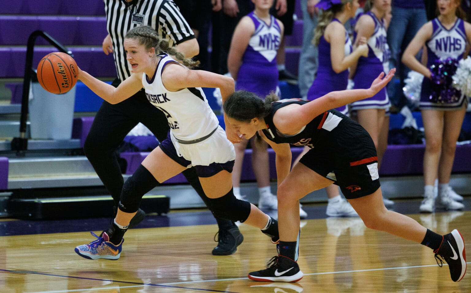 Nooksack Valley’s Lainey Kimball steals the ball and heads for the basket Dec. 10