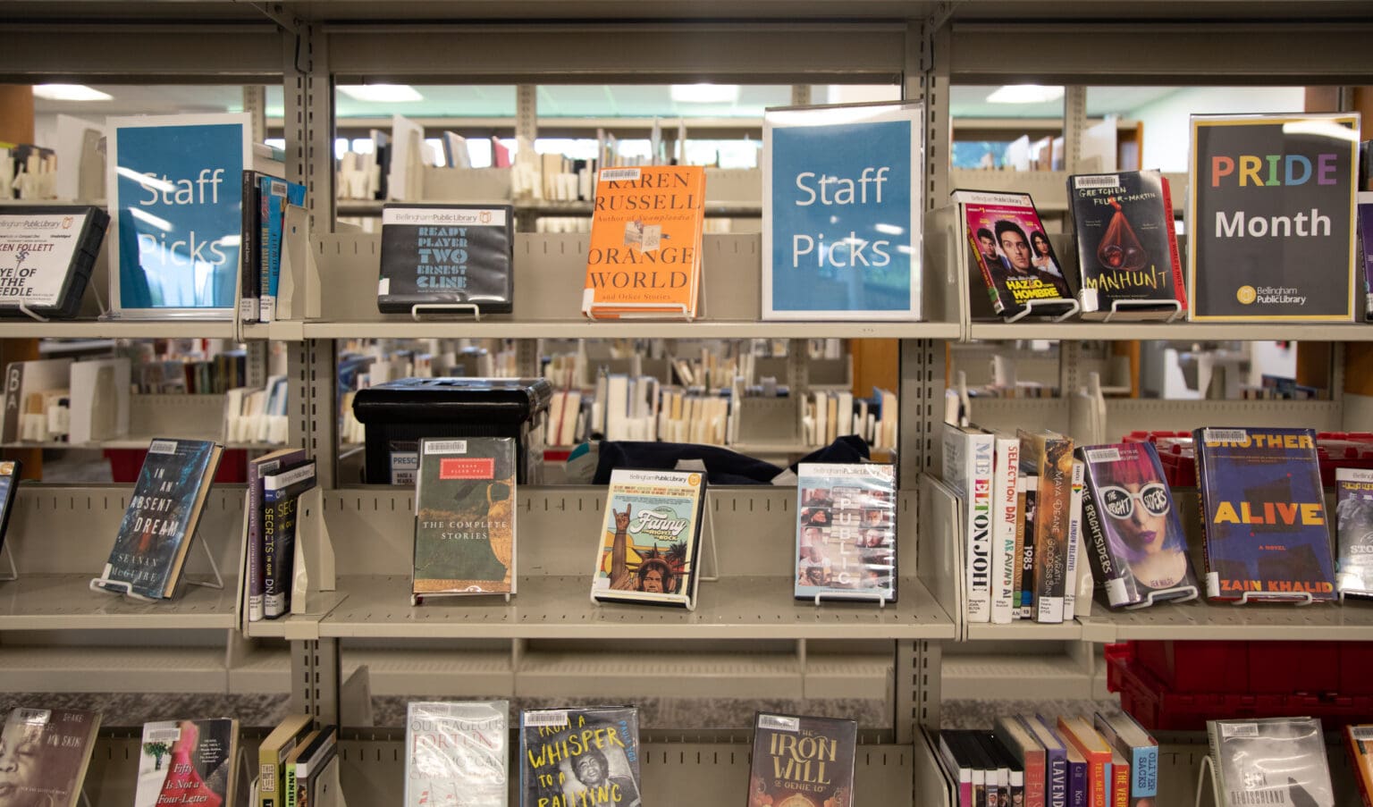 Staff Picks are shown displayed side by side on shelves at the Bellingham Public Library.