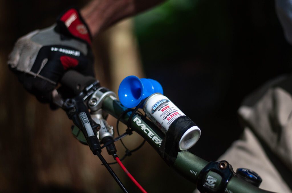 A close-up view of an air horn on a mountain bike.