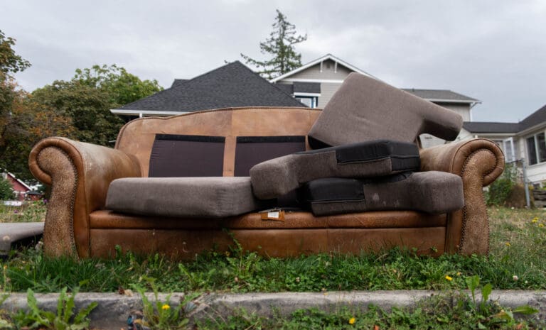 A couch sits discarded on the curb of Key Street in Bellingham on Tuesday