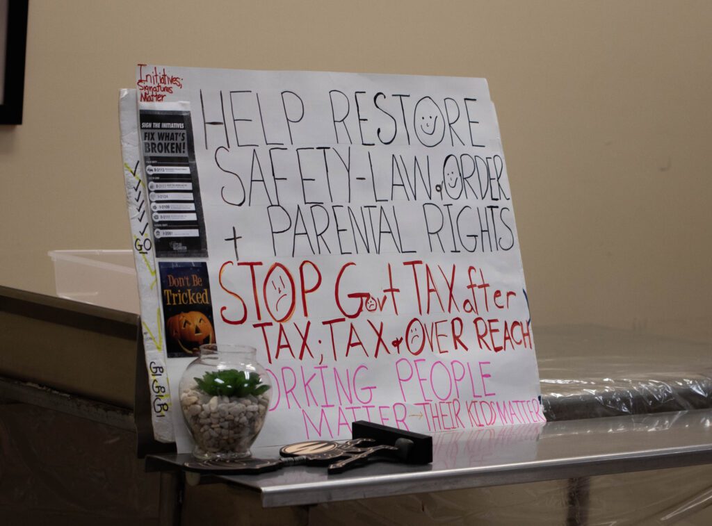 A hand written sign calling for help to restore safety-law and order + parental rights.