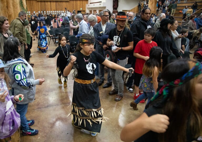 Lhaq'temish dancers celebrate Indigenous Peoples' Day with the community at the Wex'liem Building on Monday