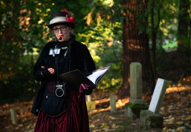 Kolby LaBree of the Good Time Girls tells the history of a gravesite during a Wednesday