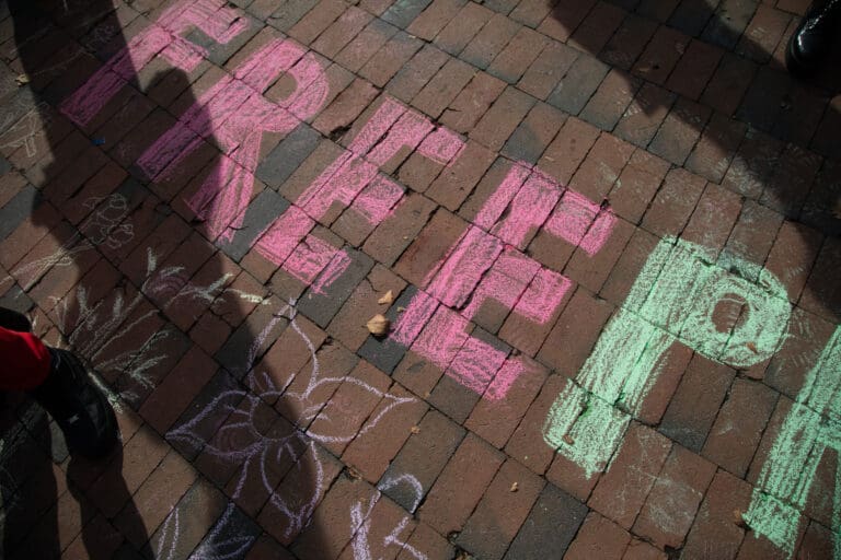 Western Washington University students wrote "Free Palestine" on the bricks in Red Square during a rally organized by the Arab Student Association on Friday