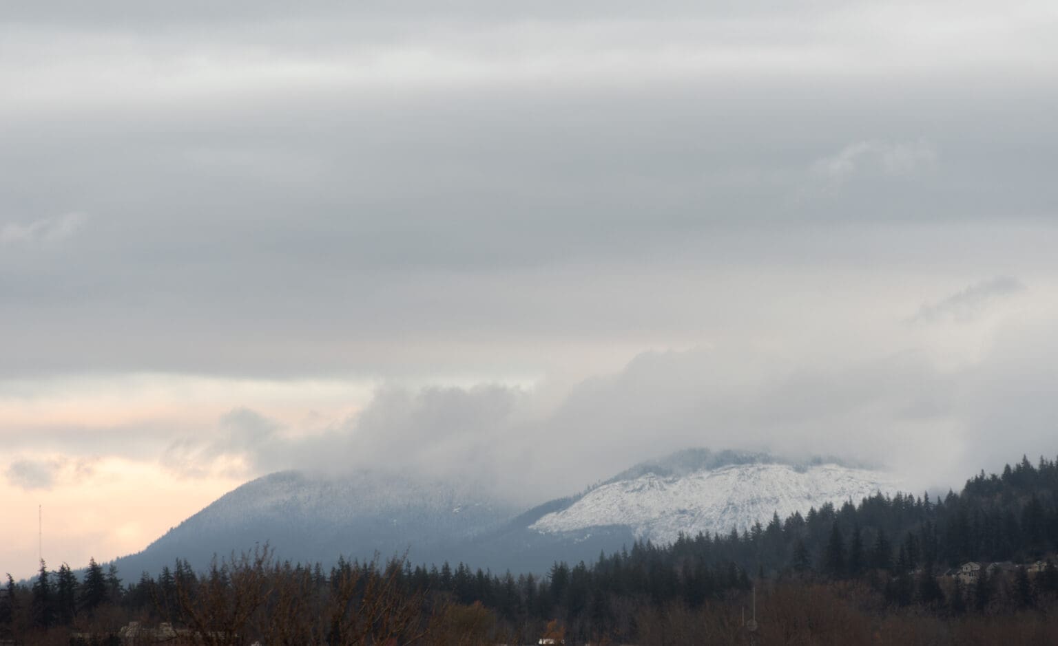 Snow crests the foothills surrounding Bellingham Friday