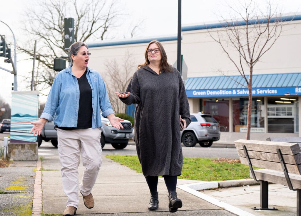 Jamie Kepros, left, and Sharon Benton walk around the Fountain District.