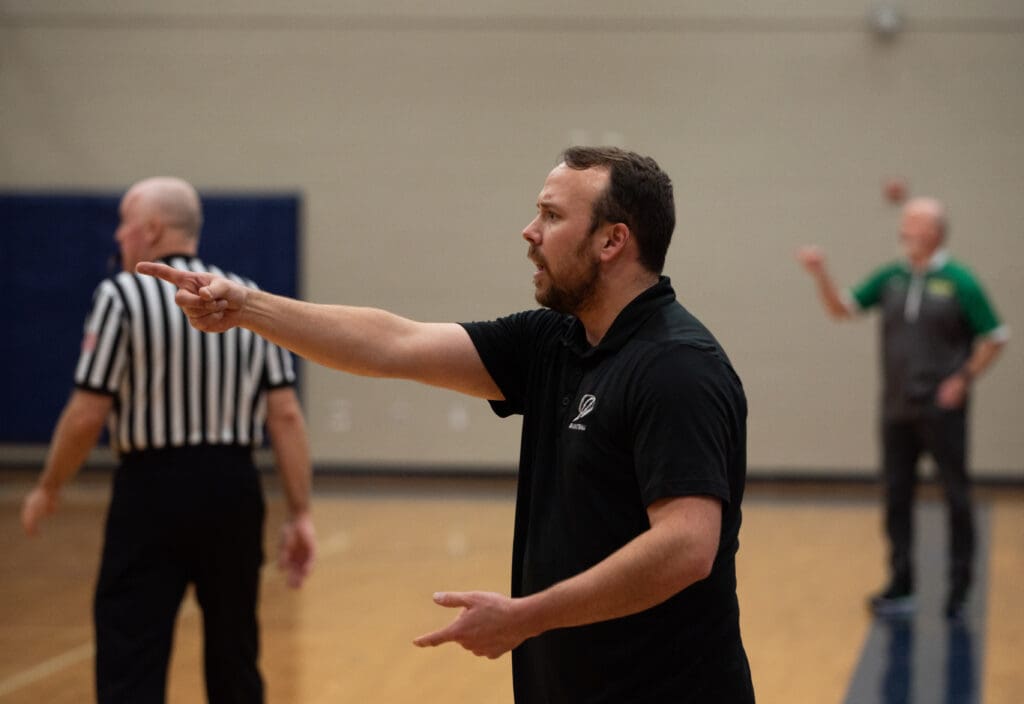 Squalicum head coach Tyler Hannigan raises a question to the referees.