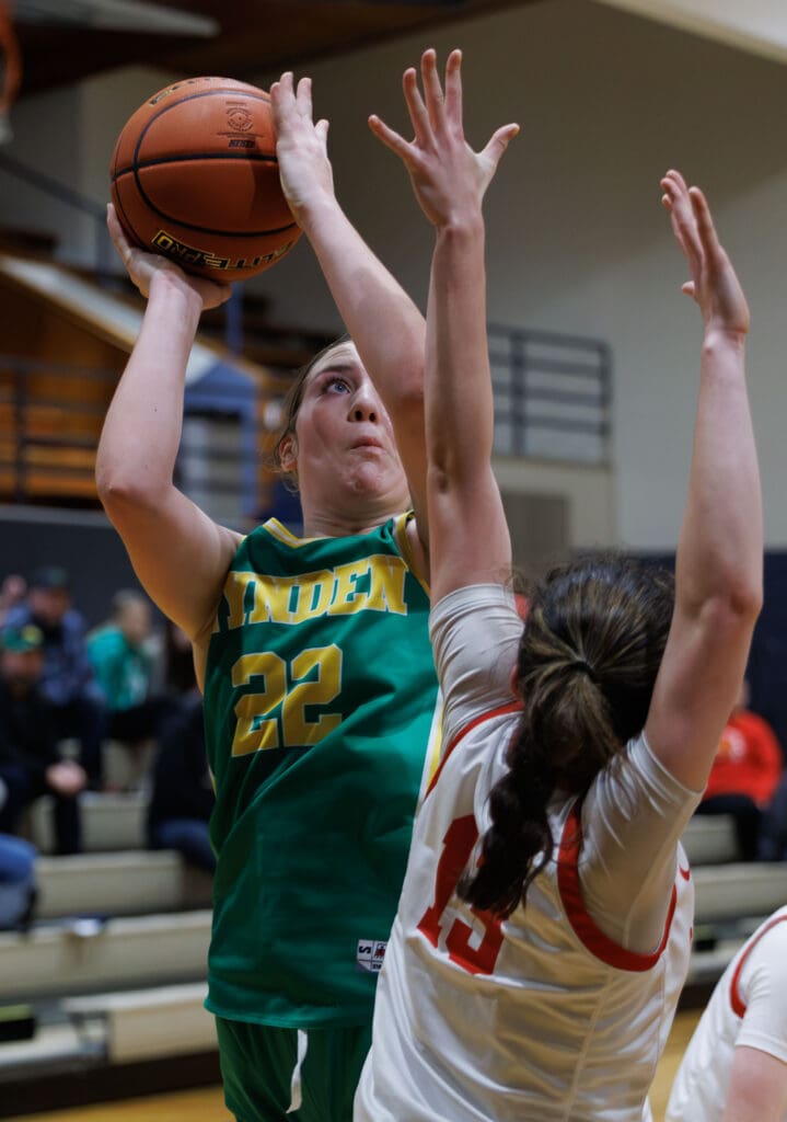 Lynden’s Finley Parcher makes a shot as a Snohomish defender reaches up to try and block it.