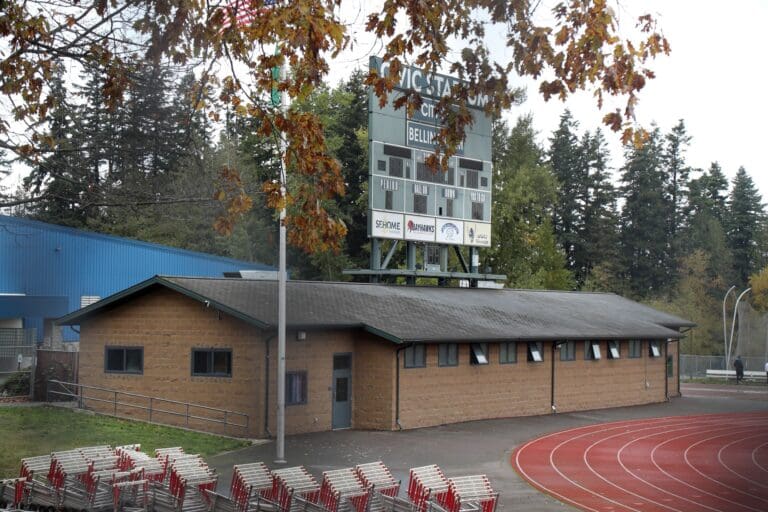The High School building next to a track field.