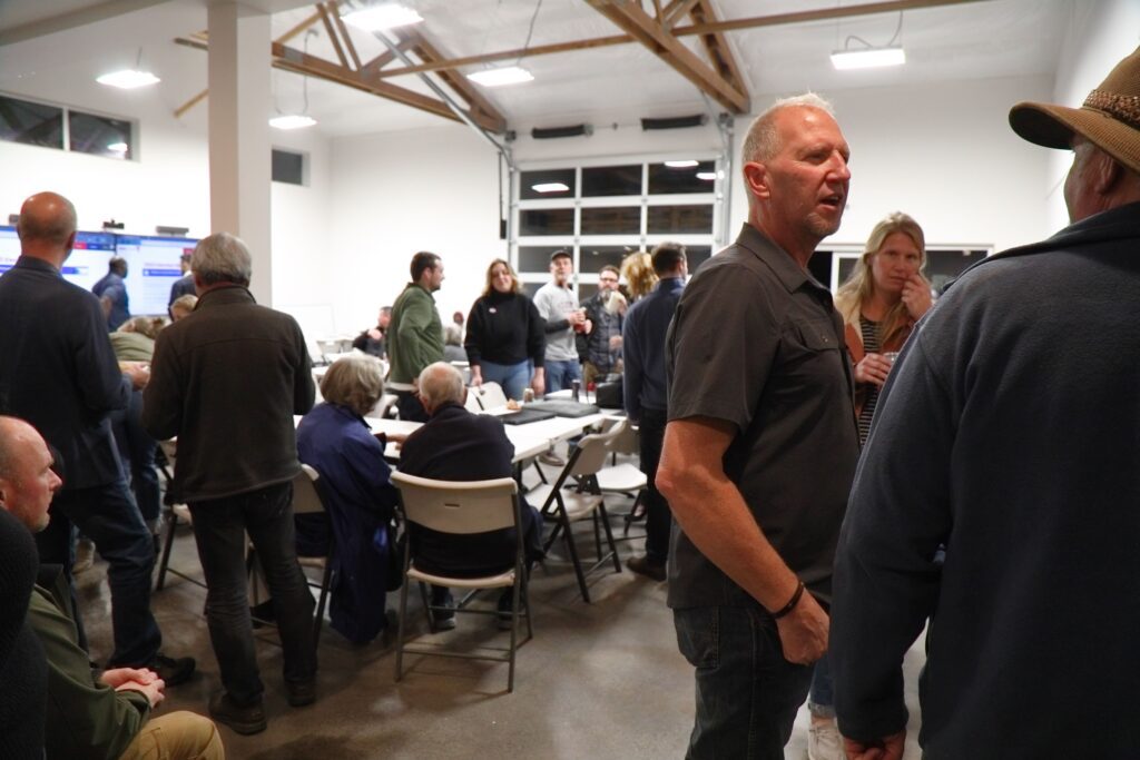 Whatcom County Council candidate Mark Stremler chats with supporters during a party at Faber Construction in Lynden prior to the release of election results.