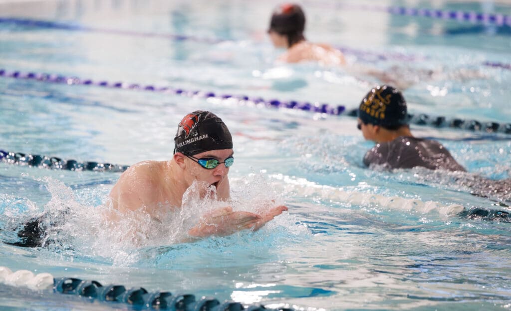Bellingham's Parker Kiniry breaches for air mid-breaststroke.
