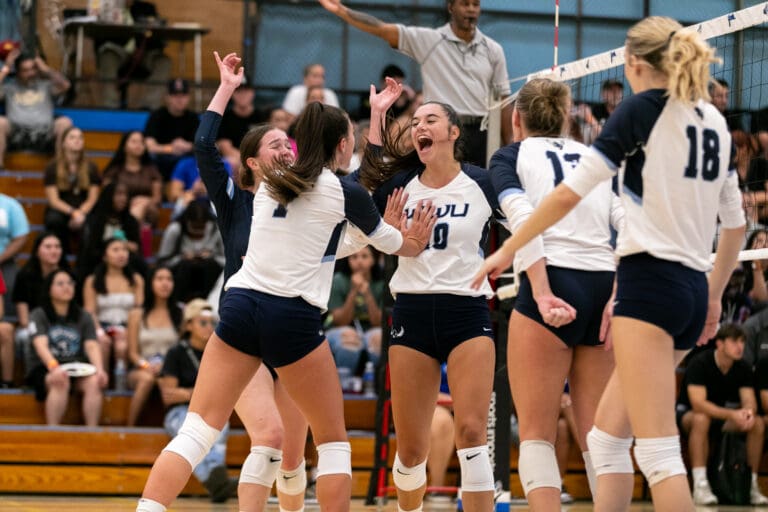 The Vikings celebrate after a point Aug. 31 during Western Washington University's match against California State University