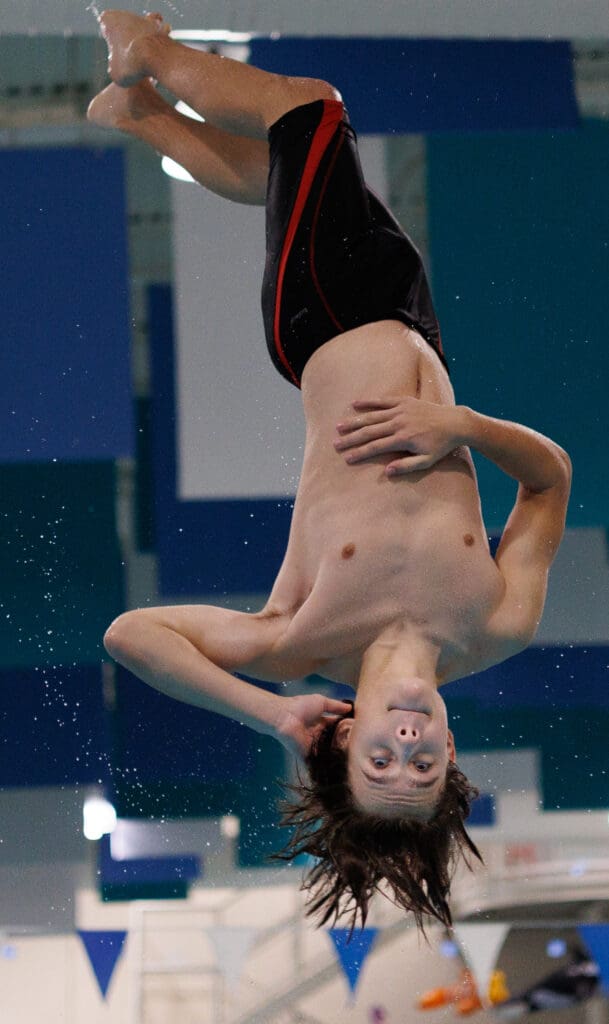 Bellingham diver Myles Ludwig twists as he catches air.