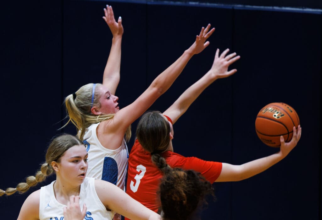 Lynden Christian’s Ella Fritts looks to block a Snohomish shot attempt.