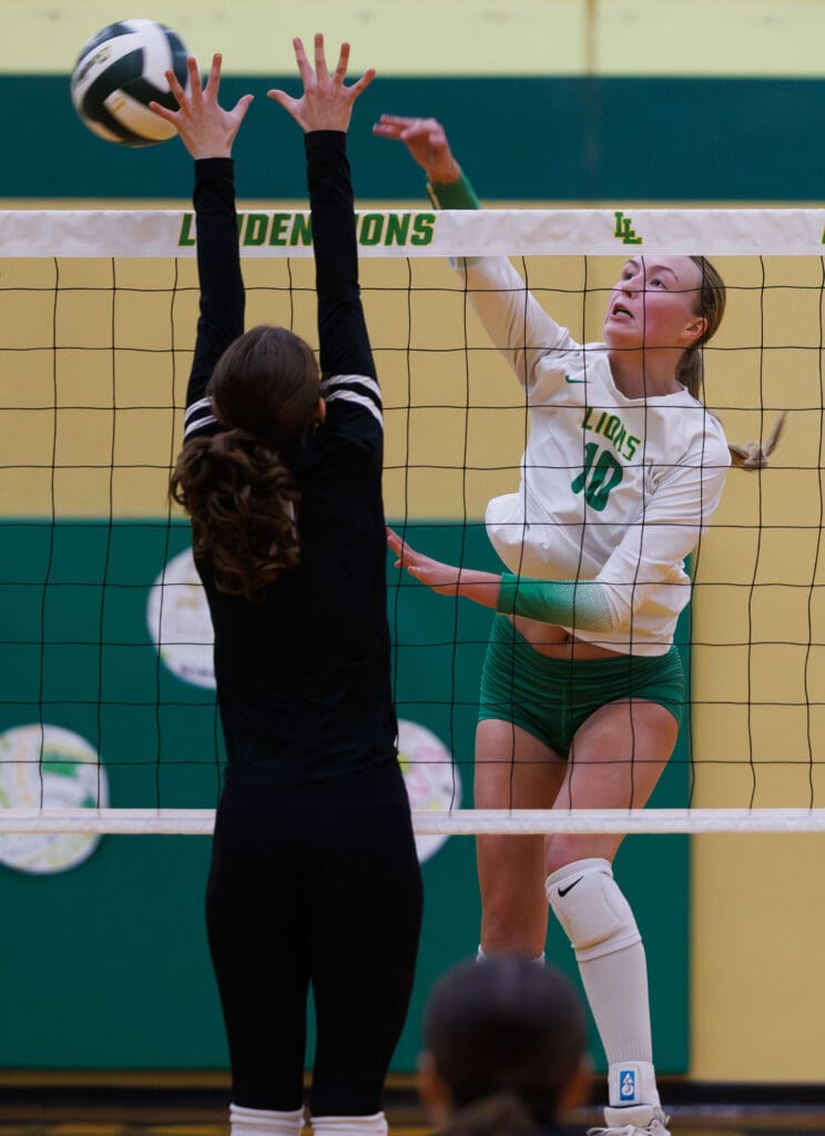 Lynden’s Ashley Shumate spikes the ball past the hands of a defender.