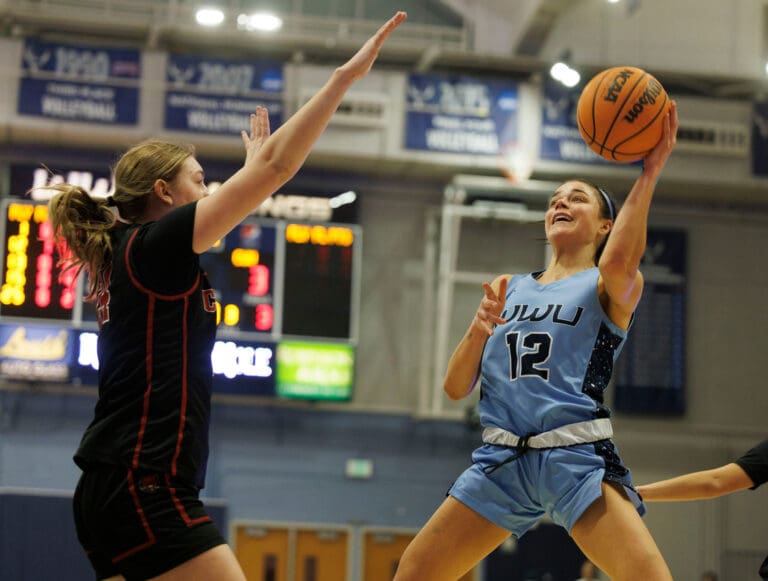 Western Washington University's Stephanie Peterson leans back for a one-handed shot.