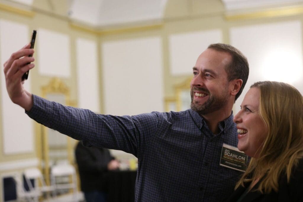 Whatcom County Council candidate Jon Scanlon takes a selfie with state Rep. Alicia Rule as they both pose and smile for the camera.