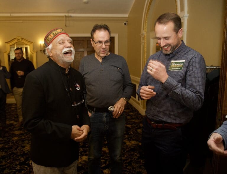Whatcom County Executive incumbent Satpal Sidhu shares a laugh with Rud Browne and Jon Scanlon after preliminary results are announced. Sidhu leads his race with 57.9% of the votes as of Wednesday