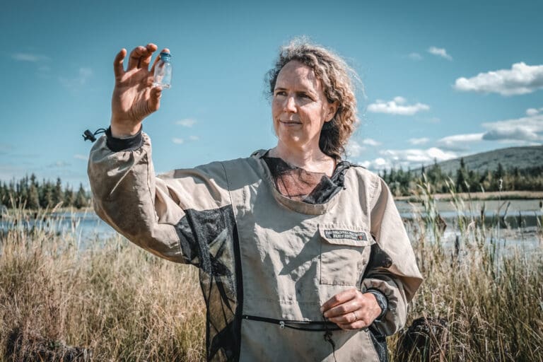 In the film “The Climate Restorers: Back to Our Future”, Dr. Katey Walter Anthony holds up a glass bottle.