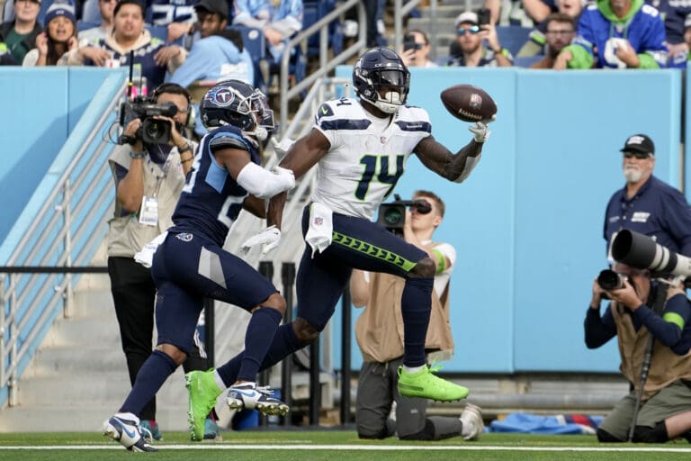 Seattle Seahawks wide receiver DK Metcalf catches a touchdown pass in front of Tennessee Titans cornerback Tre Avery Sunday