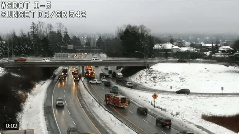 This still of a Department of Transportation video shows emergency responders at Interstate 5 and Sunset Avenue in Bellingham on Friday
