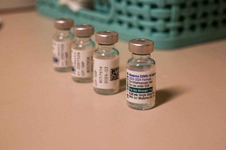Updated vaccines sit on the counter side by side.