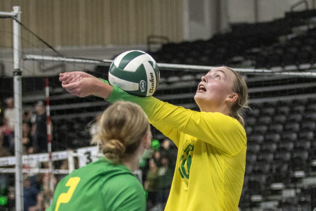 Lynden's Ashley Shumate looks above as she spikes the ball.