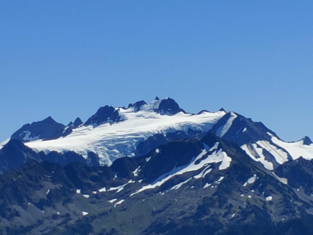 Mount Olympus in Olympic National Park has snow covering the peaks.