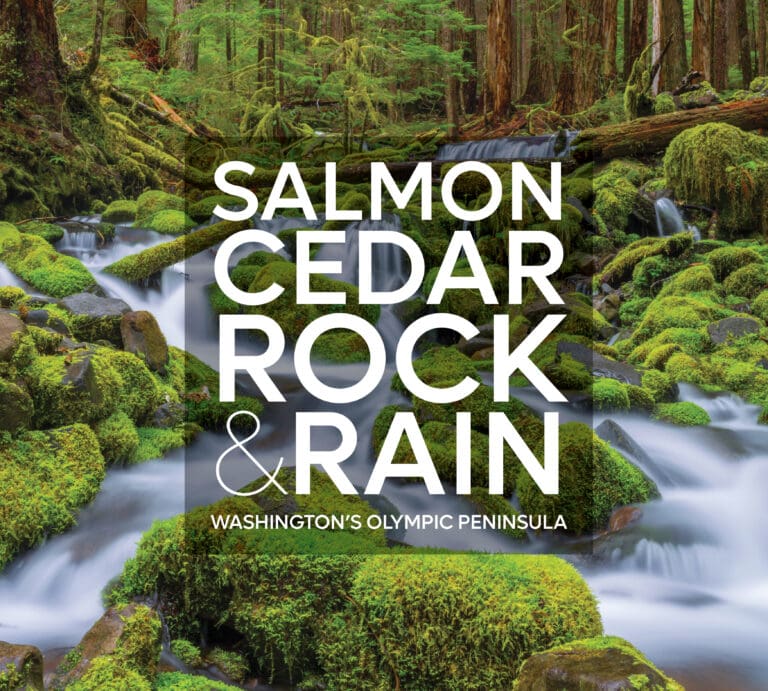 The coffee-table-sized book's cover shows rivers and forestry behind the book's title.