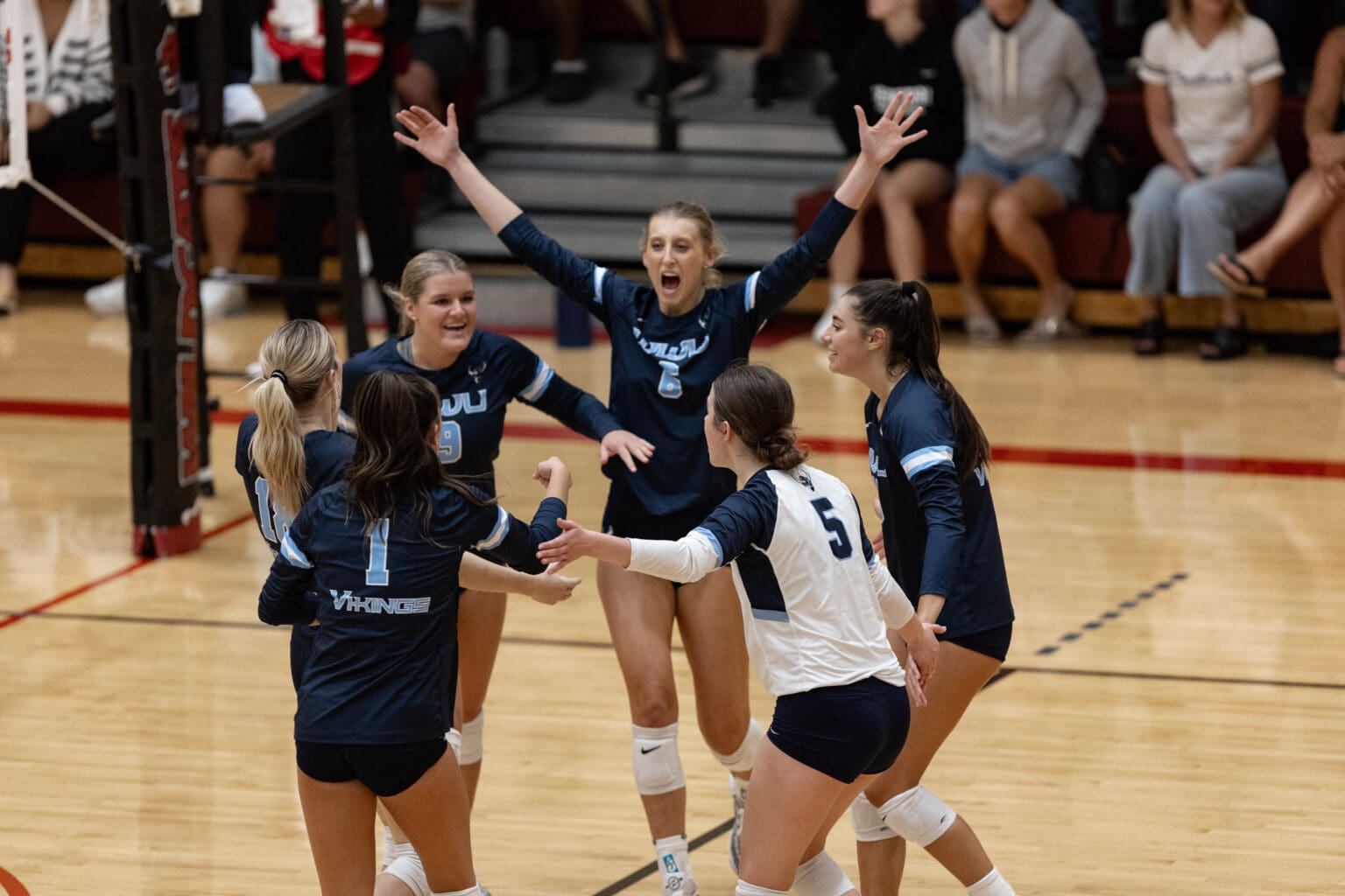 Western Washington volleyball celebrates Sept. 14 after scoring during a match at Central Washington University. The Vikings will host the Wildcats for their regular-season finale on Saturday