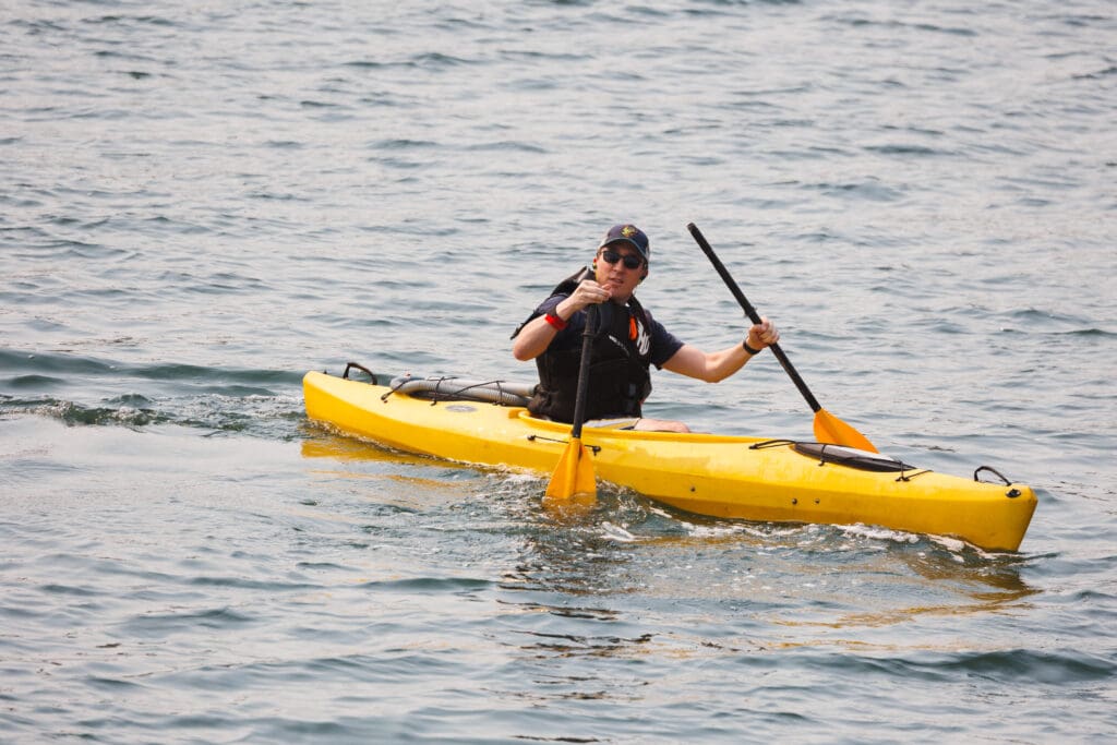 A paddler reacts as his paddle breaks in two during the Bellingham Traverse on Aug. 19 in Bellingham.