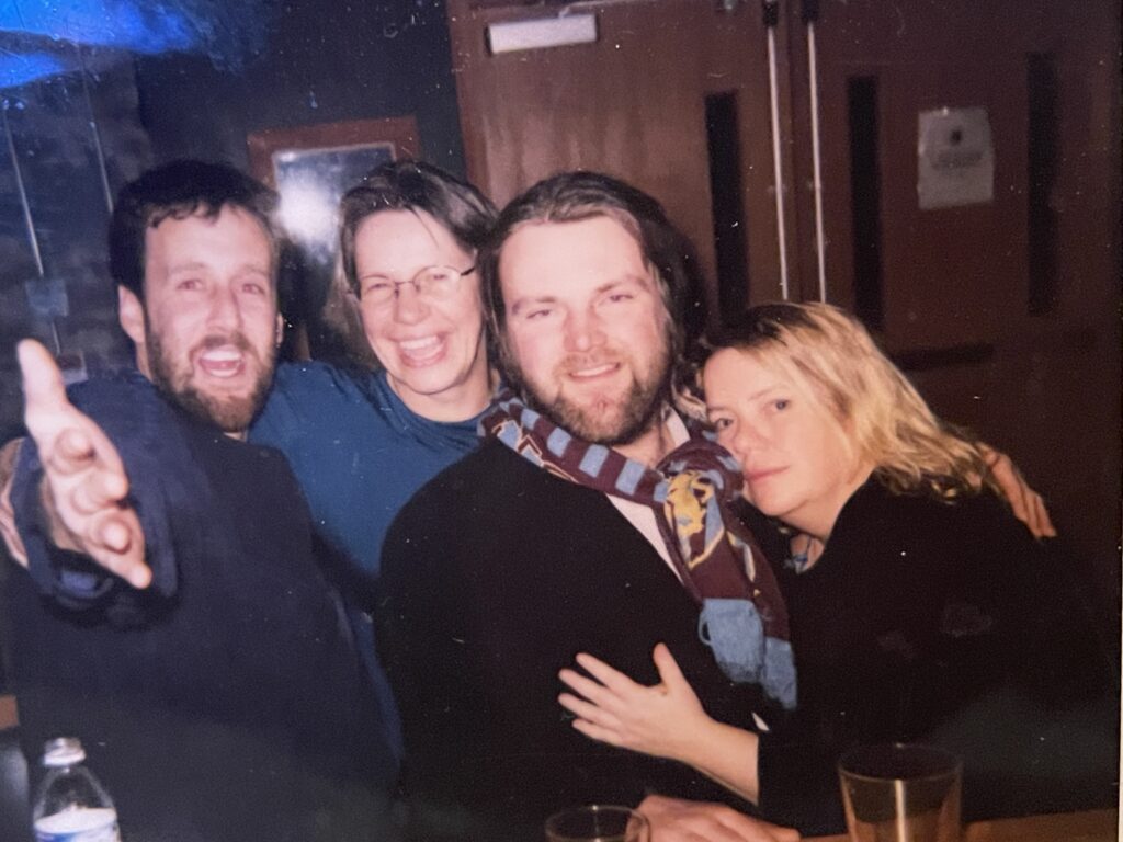From right, Amy Kepferle, Erik Burge, Ellen Clark and Christian Martin celebrate during a Bellingham Weekly Christmas party dating back to 2005.