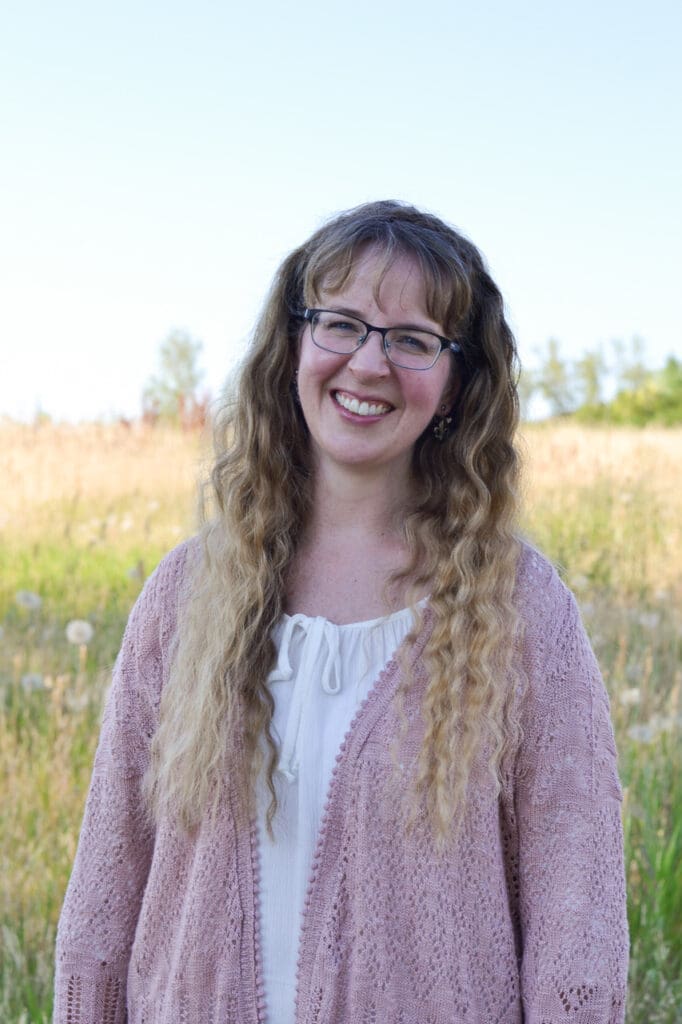 In “O Lady, Speak Again,” Bellingham poet Dayna Patterson smiles for the camera with the meadow behind her.