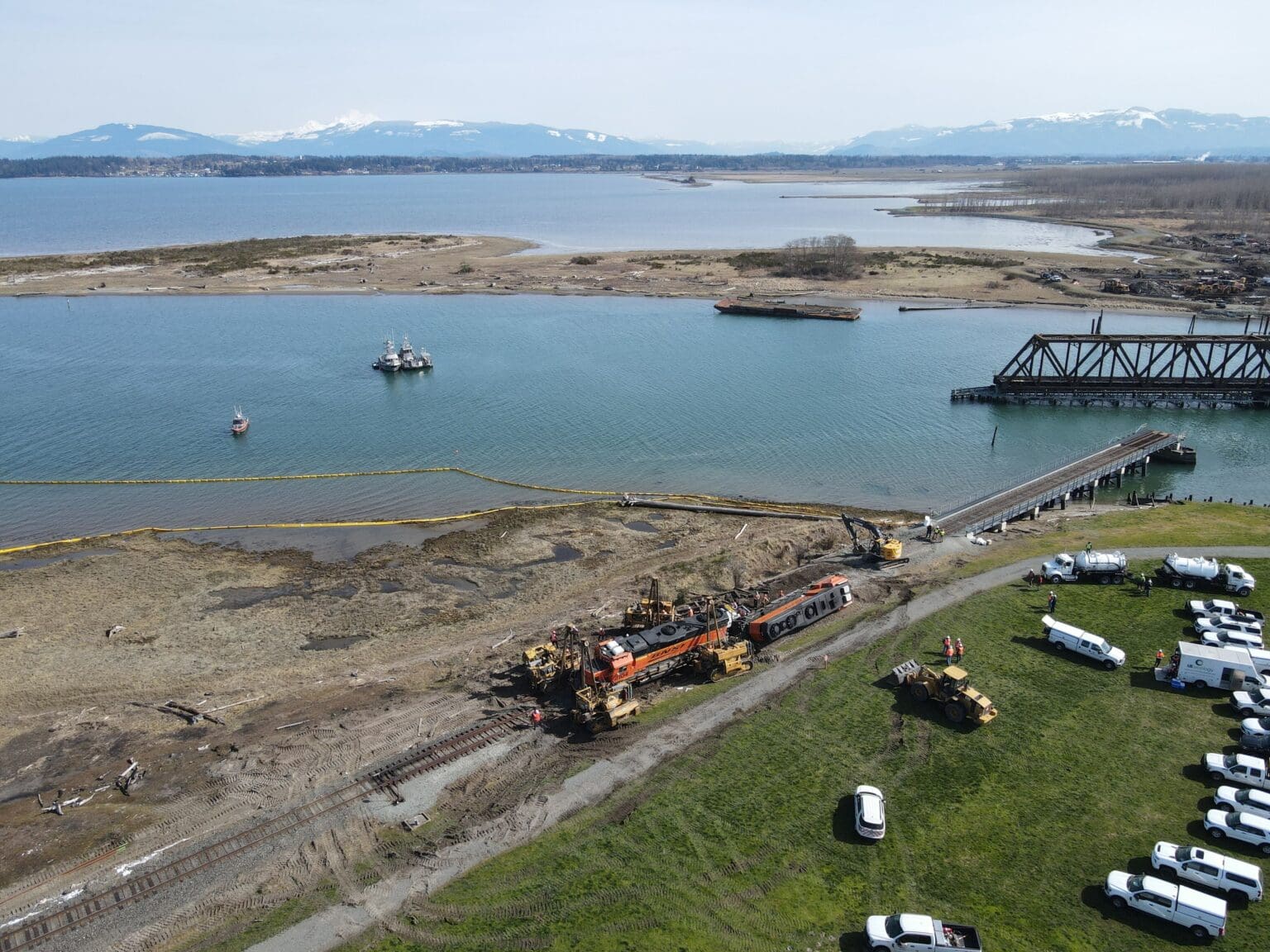Crews work to remove a pair of Burlington Northern Santa Fe locomotives that derailed on the Swinomish Reservation in Skagit County on March 16. The photo won first place in the breaking news photo category of the Washington Newspaper Association 2023 Better Newspaper Contest.