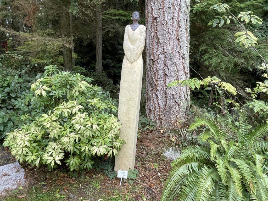 Matzke Fine Art Gallery and Sculpture Park has exhibits along the forested pathways, one of which is a long sculpture of a woman.