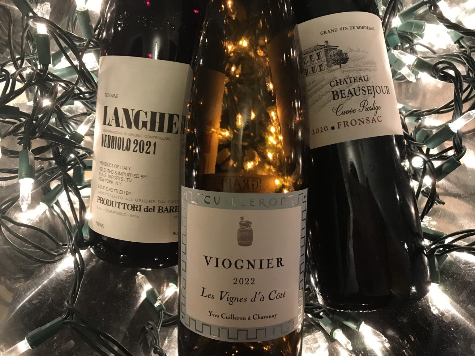 Three different brands of wine placed next to each other.