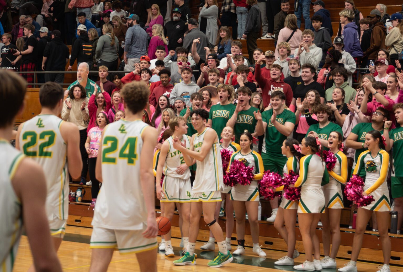 Lynden and its student section celebrate a 64-43 win over Cedarcrest Wednesday, Feb. 14 in the 2A District 1 championship game at Mount Vernon High School.