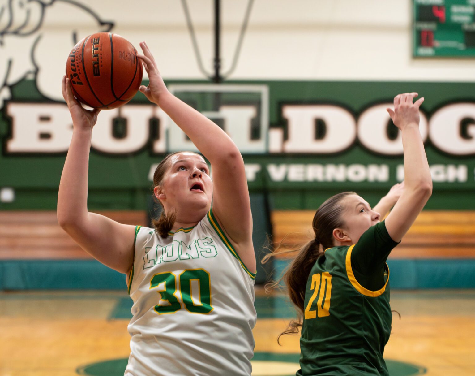 Lynden sophomore guard Payton Mills puts a rebound back up Saturday, Feb. 10 during the 2A District 1 semifinals against Sehome at Mount Vernon High School. Mill's game-high 18 points helped the Lions to a 60-20 win.