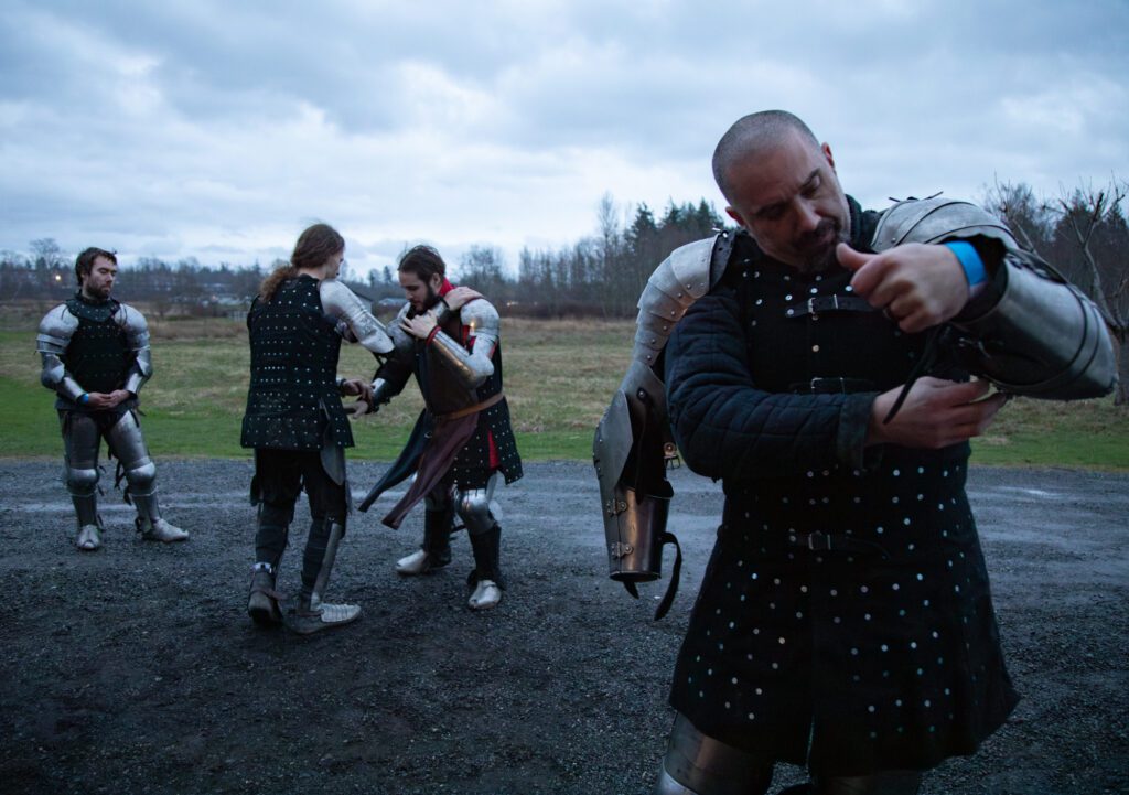 From left, Jason Gill, Johny Porter, Cord Goss and Jason McClelland of the Vagabonds — a Seattle-based armored combat team — warm up to fight other knights at the Bellingham Barbarians' first event. More than a dozen fighters duked it out to a sold-out crowd of more than a hundred locals.