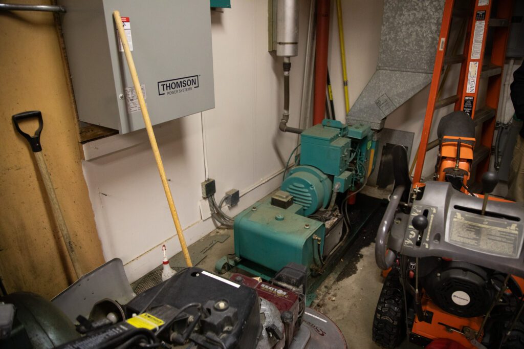 The school's backup generator from the early 1980s runs in a storage closet. When power has failed, the district has run servers off the historic piece of machinery.