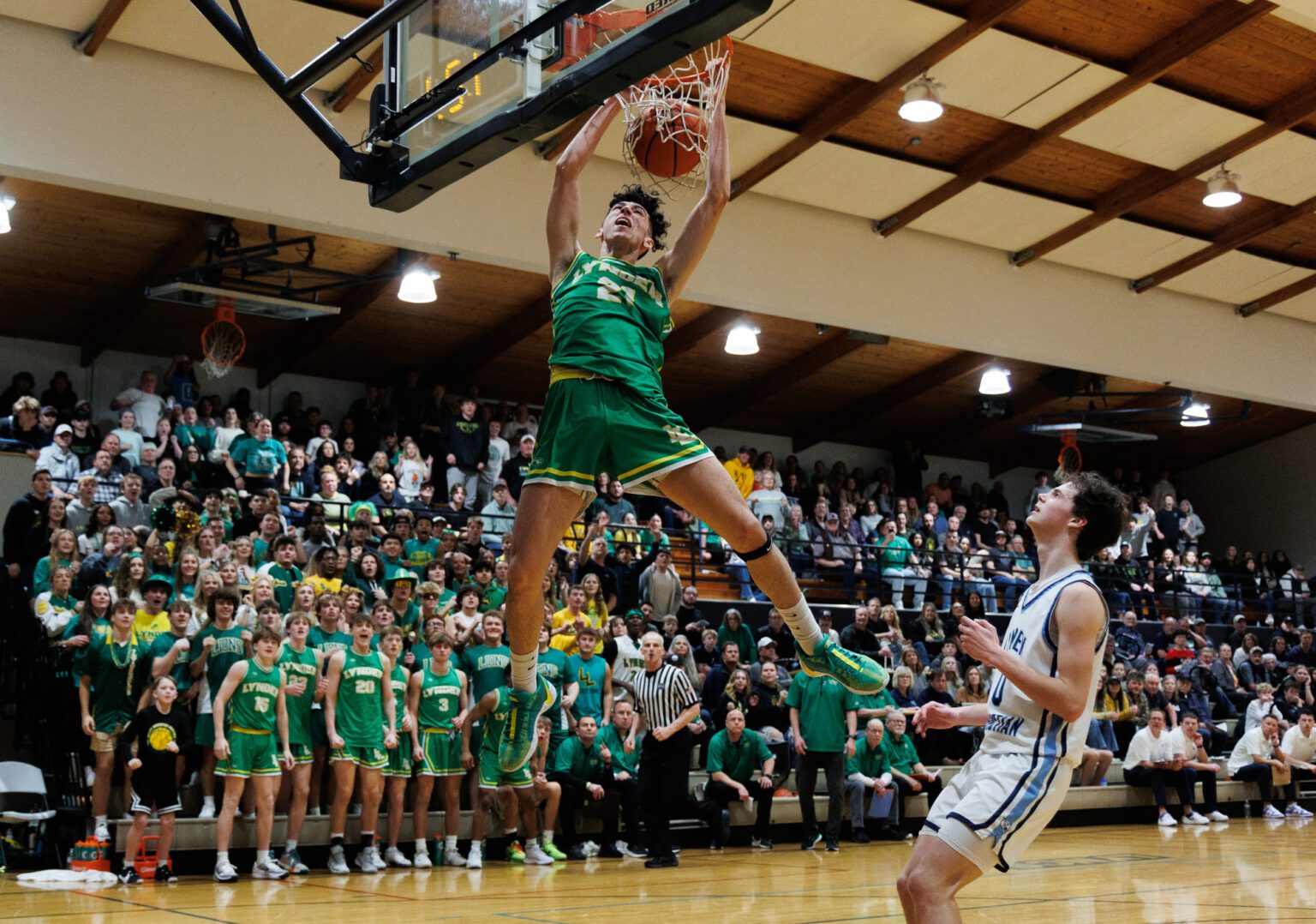 Lynden’s Anthony Canales slam dunks the ball in the fourth quarter Saturday, Feb. 3 as Lynden beat Lynden Christian 61-56 at Lynden Christian High School.